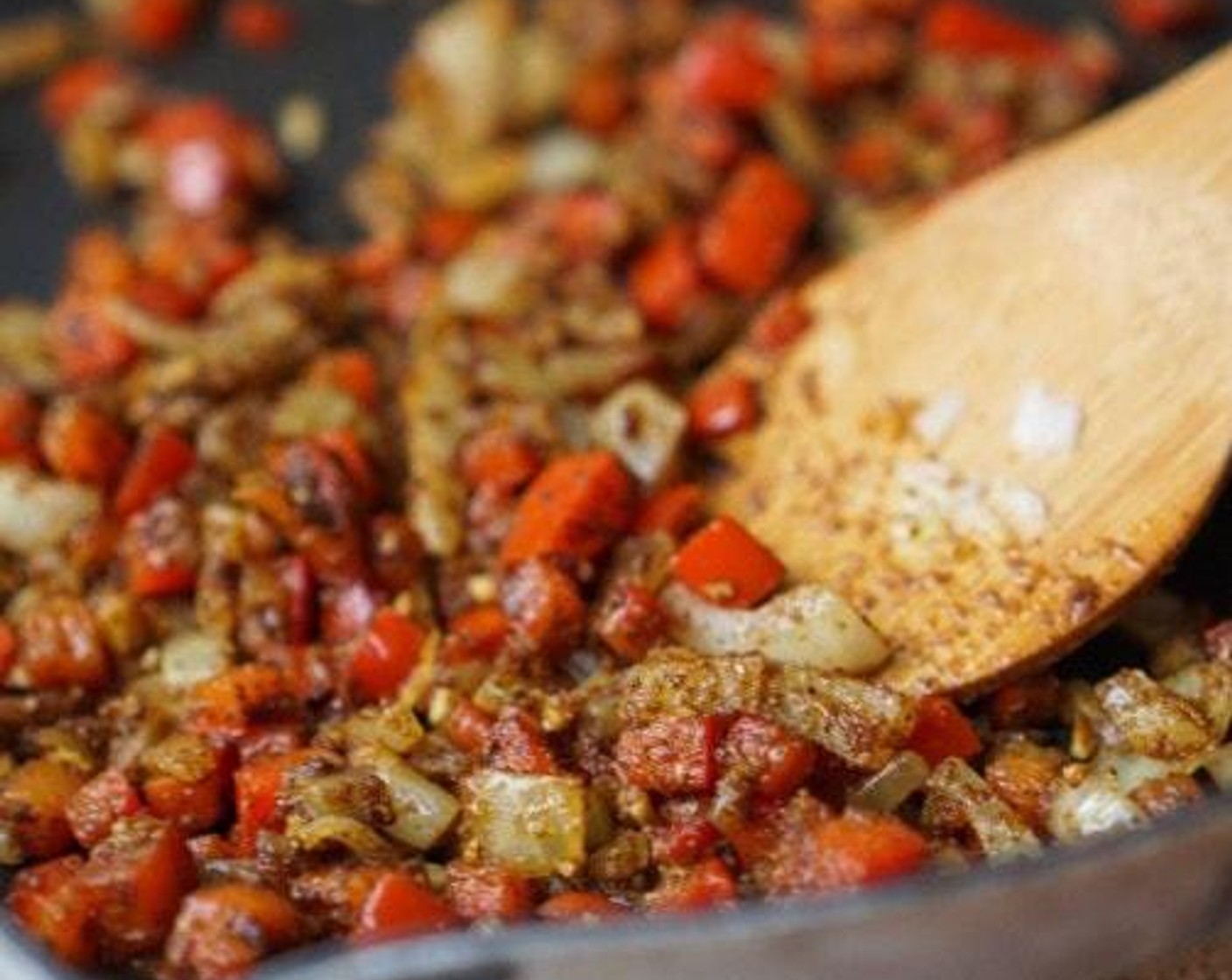 step 3 In the same pan, add the Yellow Onion (1/2 cup) and Red Bell Pepper (1/2 cup). If needed, add one more tablespoon of Olive Oil (as needed). Cook until soft and the onions are translucent; about 3 minutes.