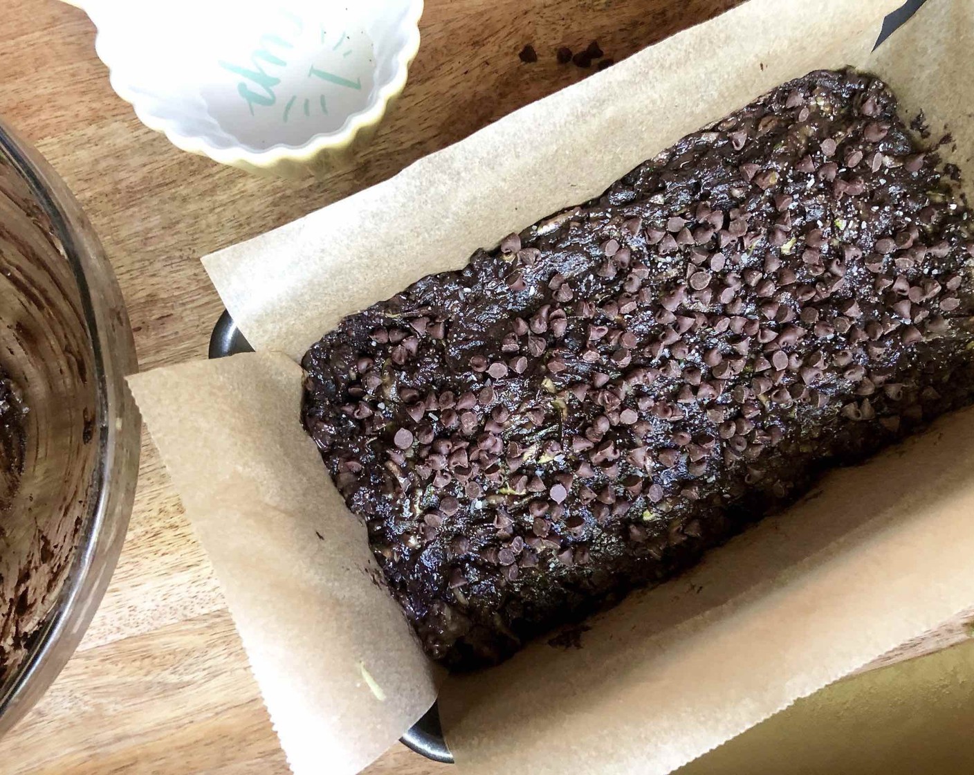 step 9 Pour the batter into the prepared loaf pan, spreading it smooth with a spatula. Sprinkle with a generous pinch of  Coarse Kosher Salt (to taste) along with the remaining Semi-Sweet Chocolate Chips (1/4 cup).