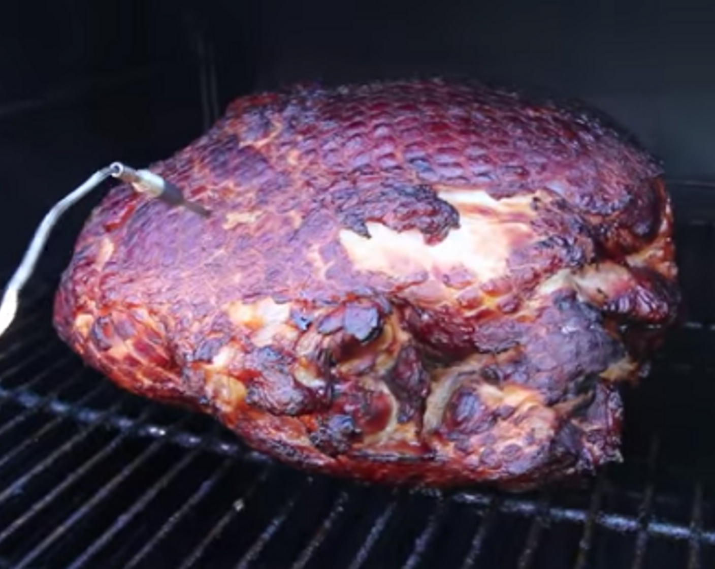 step 3 After the ham cooks for 1 1/2 hours, insert a probe thermometer into the center away from the bone to monitor temperature.