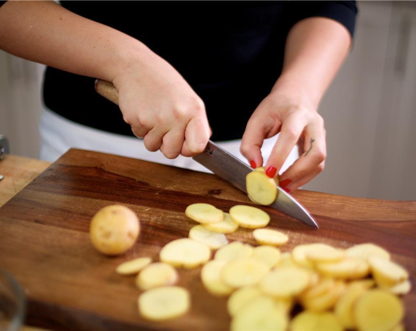 step 5 Cut the Baby Yukon Gold Potatoes (2 1/4 cups) into half inch slices and place into another medium bowl. Drizzle Olive Oil (2 Tbsp) over the potatoes and season with Salt (1/2 tsp), Ground Black Pepper (1/4 tsp) and the remaining garlic.