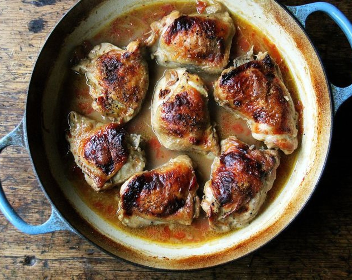 step 10 Return the cooking juice and chicken to the pan. Bring to a gentle simmer.