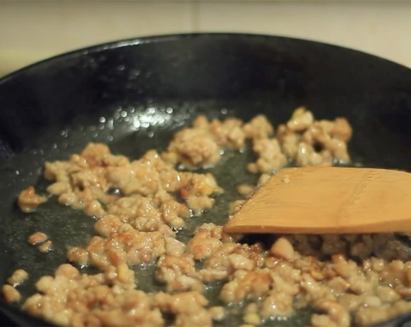 step 6 Heat up cooking Oil (2 Tbsp) on wok or pan, add the marinated minced pork in to stir-fry until the color changes and then put carrots and mushrooms to fry until soft.