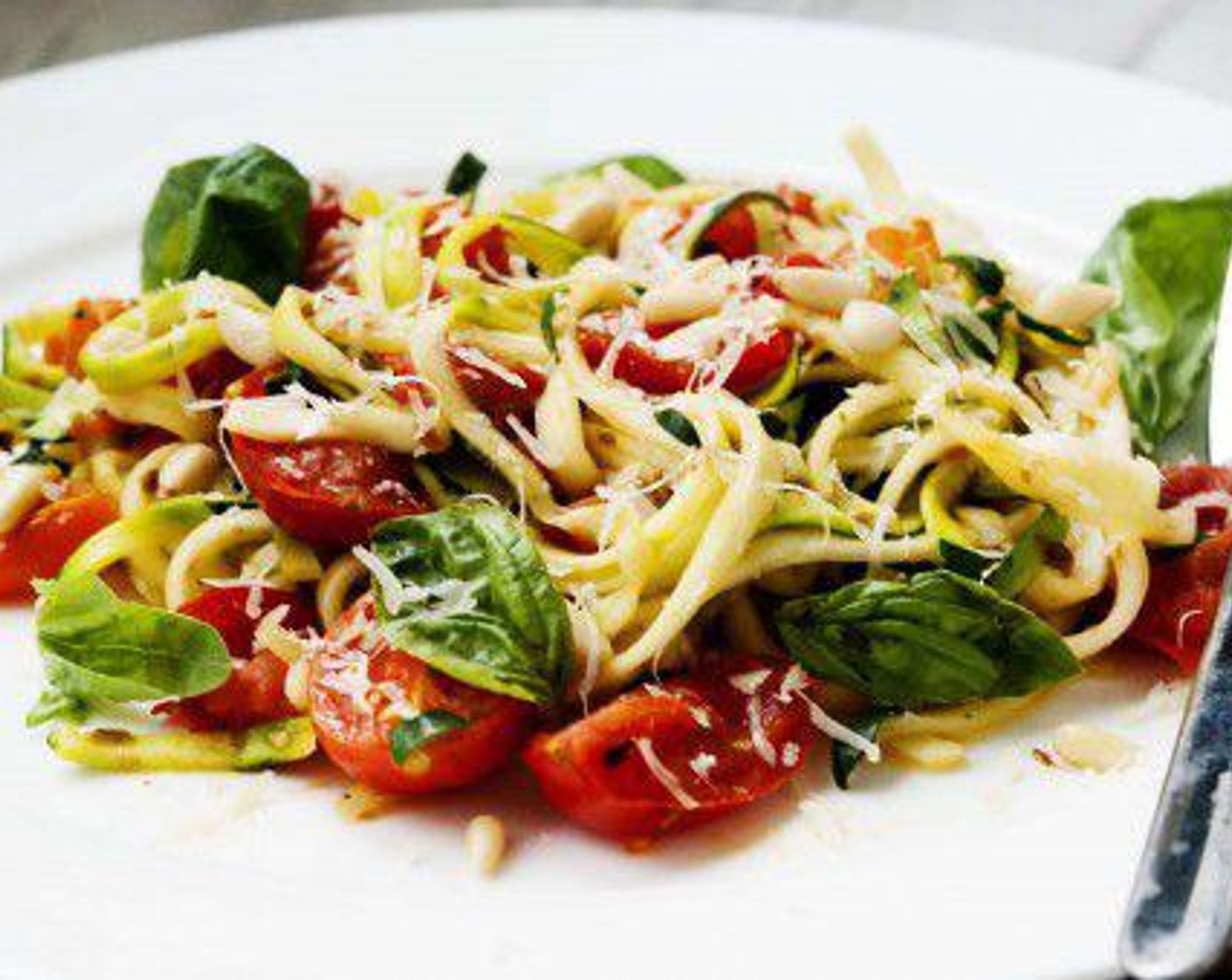 step 4 Plate it then sprinkle with Pine Nuts (to taste), Parmesan Cheese (to taste), and Fresh Basil (to taste).