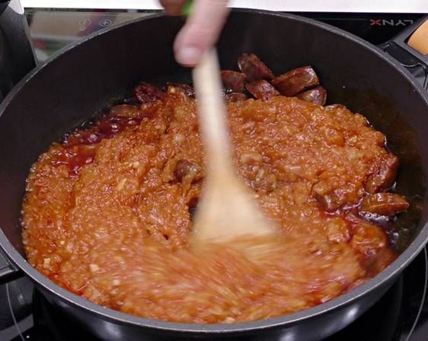 step 3 Once the sausage has cooked through and released some of its oils add the Canned Tomato Purée (to taste) and cook together for a few minutes.