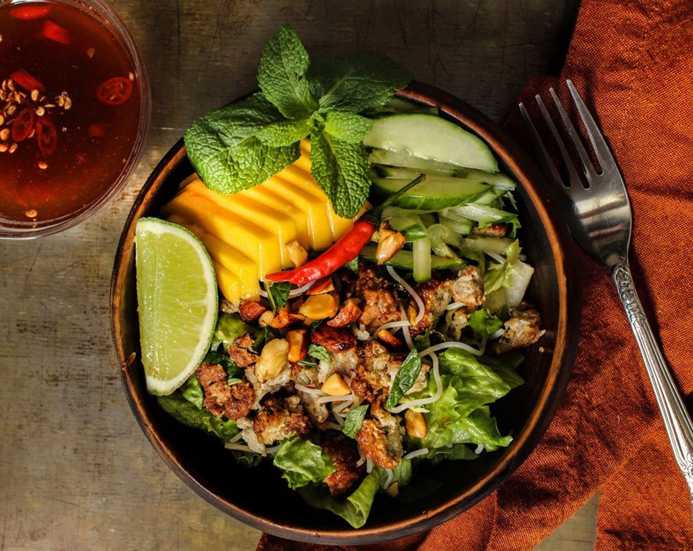 step 10 As a Salad – Chop up any type of green lettuce and top it with chopped vermicelli, bean sprouts or any type of fresh vegetables and fruits like mango. Serve with crushed nuts for some crunch and a light vinaigrette dressing such as Nuoc Cham (sweet, sour and salty fish sauce dressing).