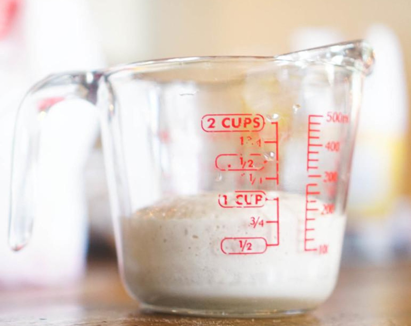 step 2 Place the Water (1/4 cup), Granulated Sugar (1 Tbsp), and Active Dry Yeast (1 pckg) in a 1 cup measuring cup. Stir for two seconds, then set aside for ten minutes. The yeast will foam, double in size, and should reach the 3/4-cup line.
