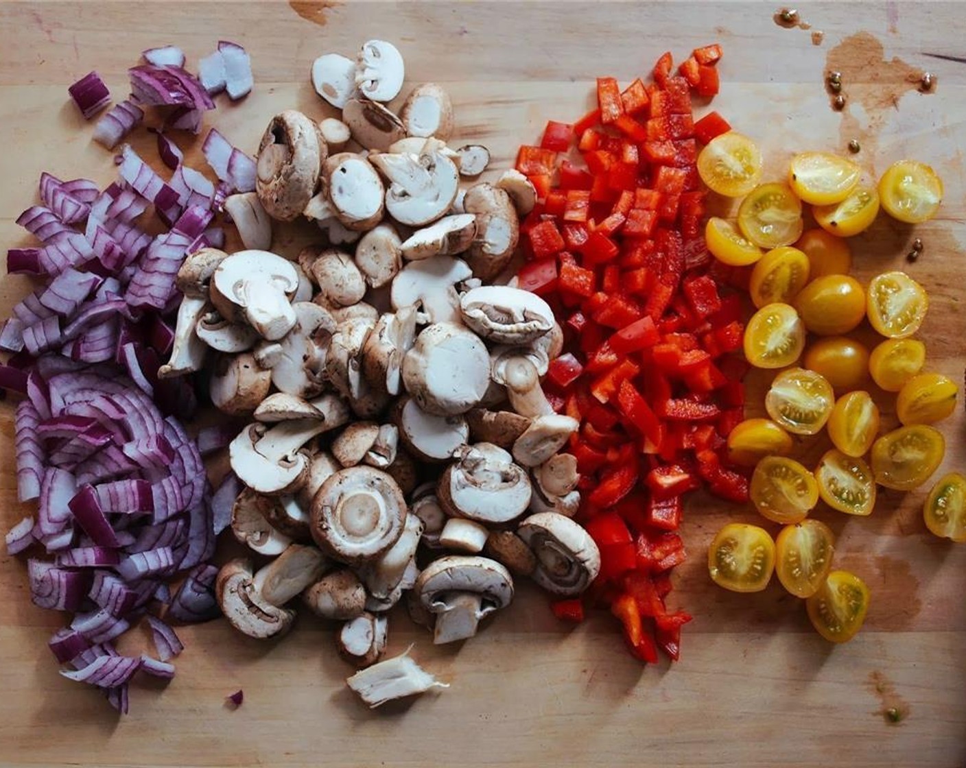 step 7 In a large skillet/wok, heat oil over medium heat. Add onions, cook for 4-5 minutes, add in Onion (1), Mushrooms (2 1/4 cups), Grape Tomatoes (12), Bell Pepper (1), and McCormick® Garlic Powder (1 tsp). Cook for another 4 minutes or so.