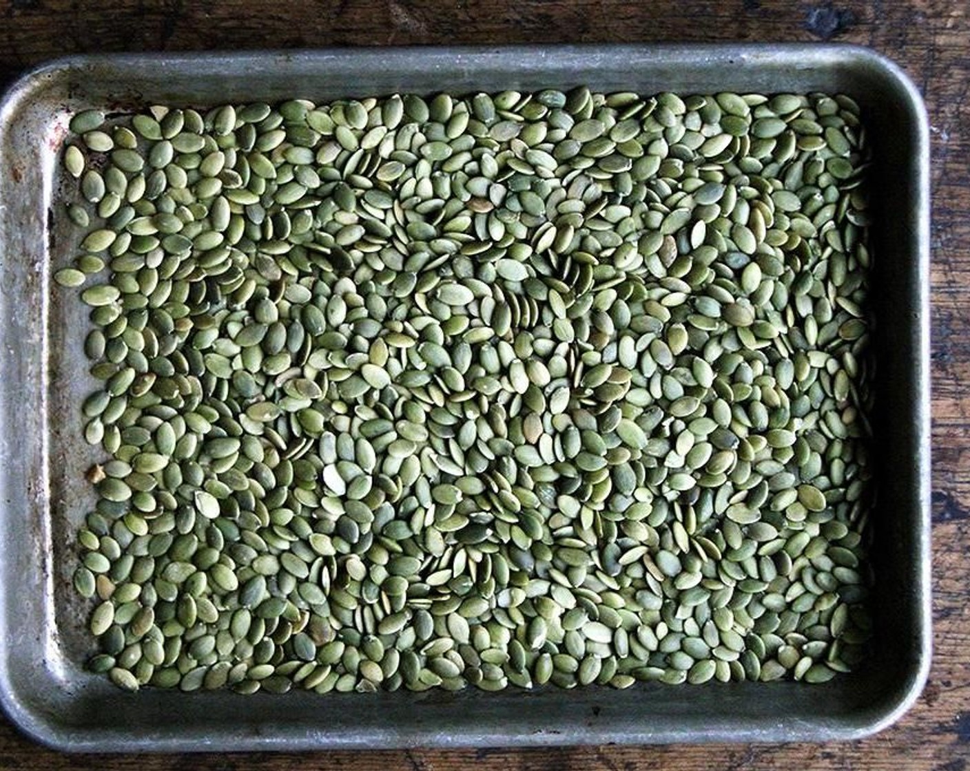 step 2 Place Pepitas (1 1/4 cups) on rimmed sheet pan. Transfer to oven and cook for 5 minutes—seeds should barely take on any color. Set pan aside to cool.