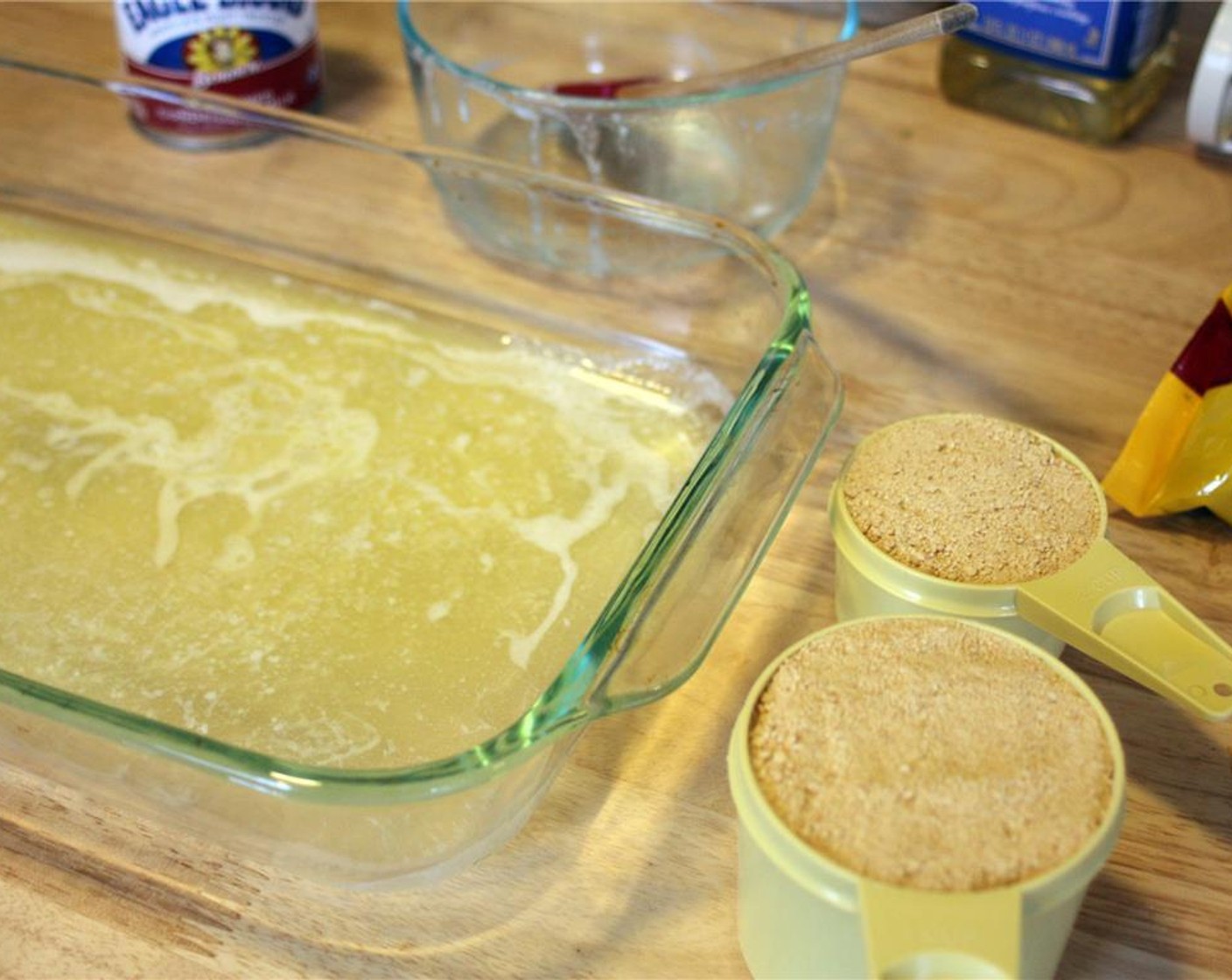 step 3 Place the melted butter in a 9×13 pan (preferably glass, but aluminum works as well) and spread it out so that it evenly coats the bottom.