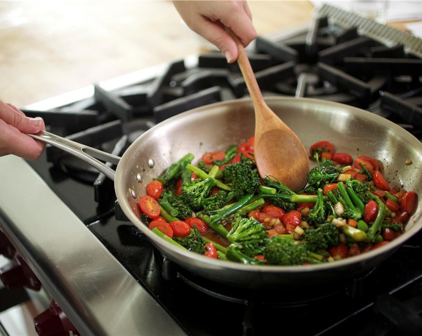 step 7 Without rinsing the saute pan, return it to medium high heat. When hot, add the broccolini and asparagus, and cook for two minutes while occasionally stirring.