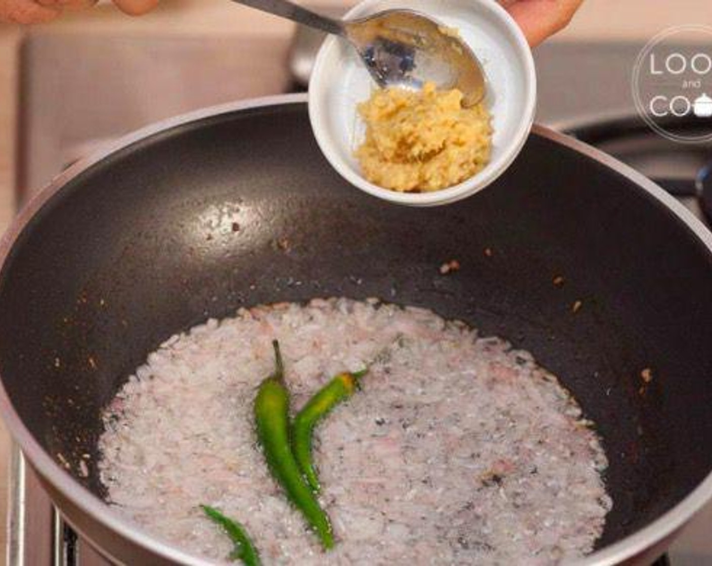 step 5 Heat Vegetable Oil (3 Tbsp) in a pan. Add Onion (1), Green Chili Peppers (6), and Ginger Garlic Paste (2 Tbsp). Stir fry it.