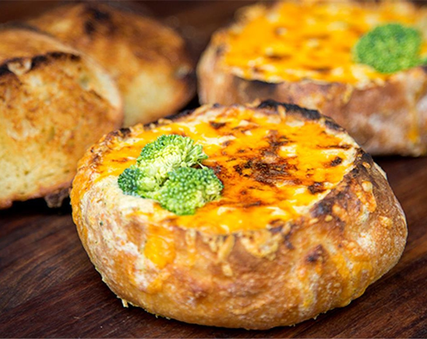 step 8 Ladle into Sourdough Rolls (4) and garnish with cheese or croutons or both. Broil in the oven for a few minutes to get a little browning on the top of adding to bread bowls.