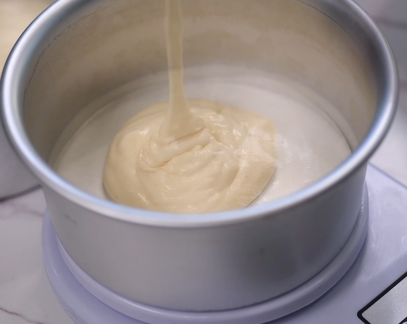 step 5 Transfer the batter into the two cake pans, batter weighing about 100 grams each.