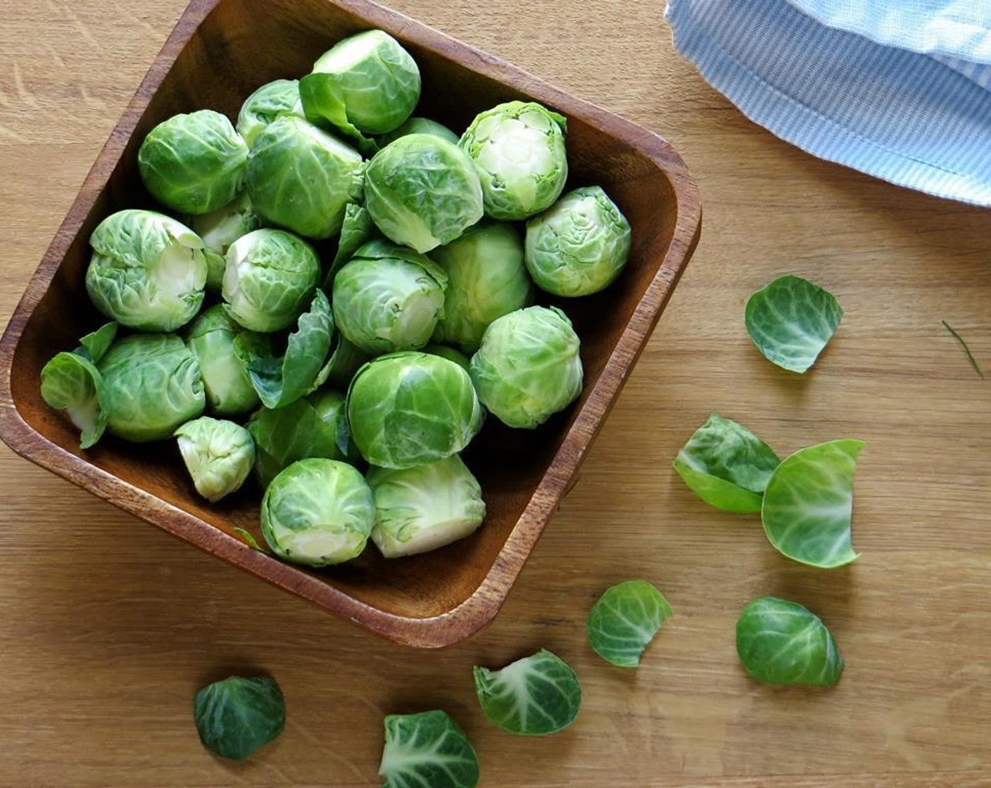 step 4 Trim the roots from the Brussels Sprouts (4 cups) and shred them. There's a lot of shredding in this slaw - for the ultimate ease - use the shredder attachment on your food processor. Otherwise, a box grater or mandoline work well.