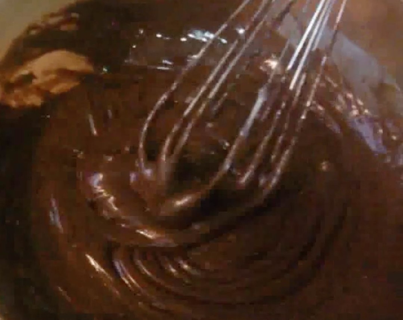 step 2 Into a mixing bowl, add Sweetened Condensed Milk (1 1/3 cups) and Vanilla Extract (1/2 tsp). Whisk in the chocolate until everything is well combined.