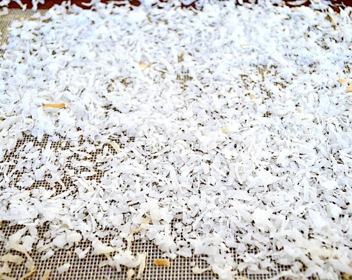 step 4 While it bakes, spread the Unsweetened Shredded Coconut (1 cup) out onto a lined sheet tray and toast it in the oven with the crust on another shelf. It should take 5-7 minutes for it to toast perfectly. Let the crust and coconut cool completely once they are done.