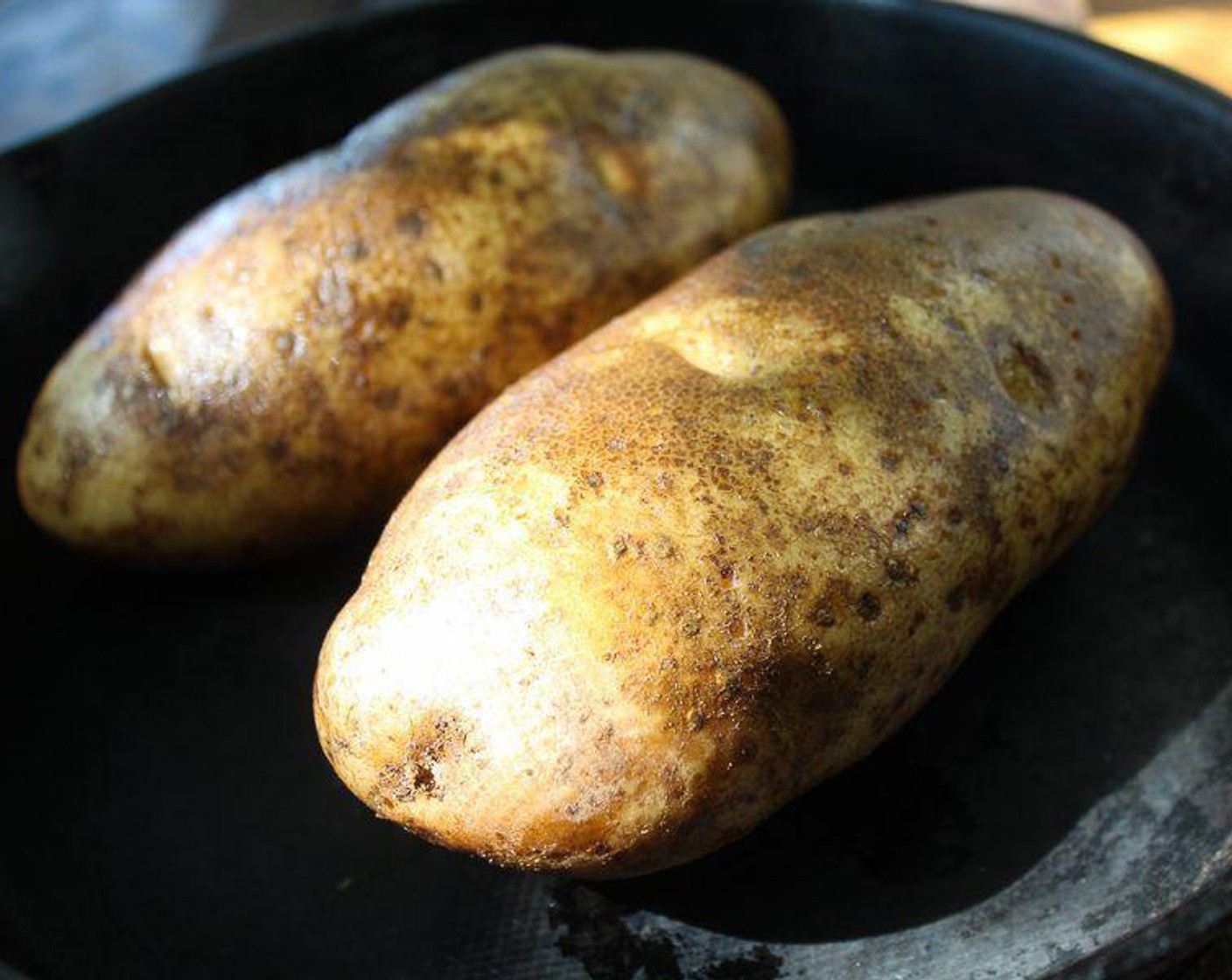 step 2 Wash and scrub the Potatoes (2), then prick all over several times with a fork. Rub each potato with Vegetable Oil (1/2 Tbsp).