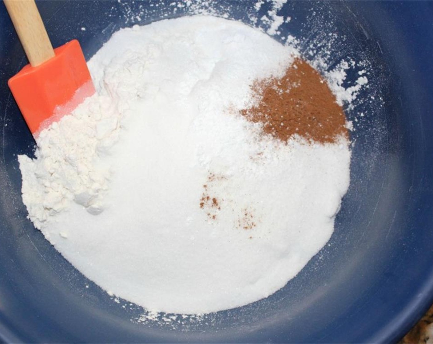 step 2 In a large bowl, stir together All-Purpose Flour (2 cups), Granulated Sugar (2 cups), Baking Powder (1/2 Tbsp), Ground Cinnamon (1 tsp), Salt (1/2 tsp), and Baking Soda (1/2 tsp).