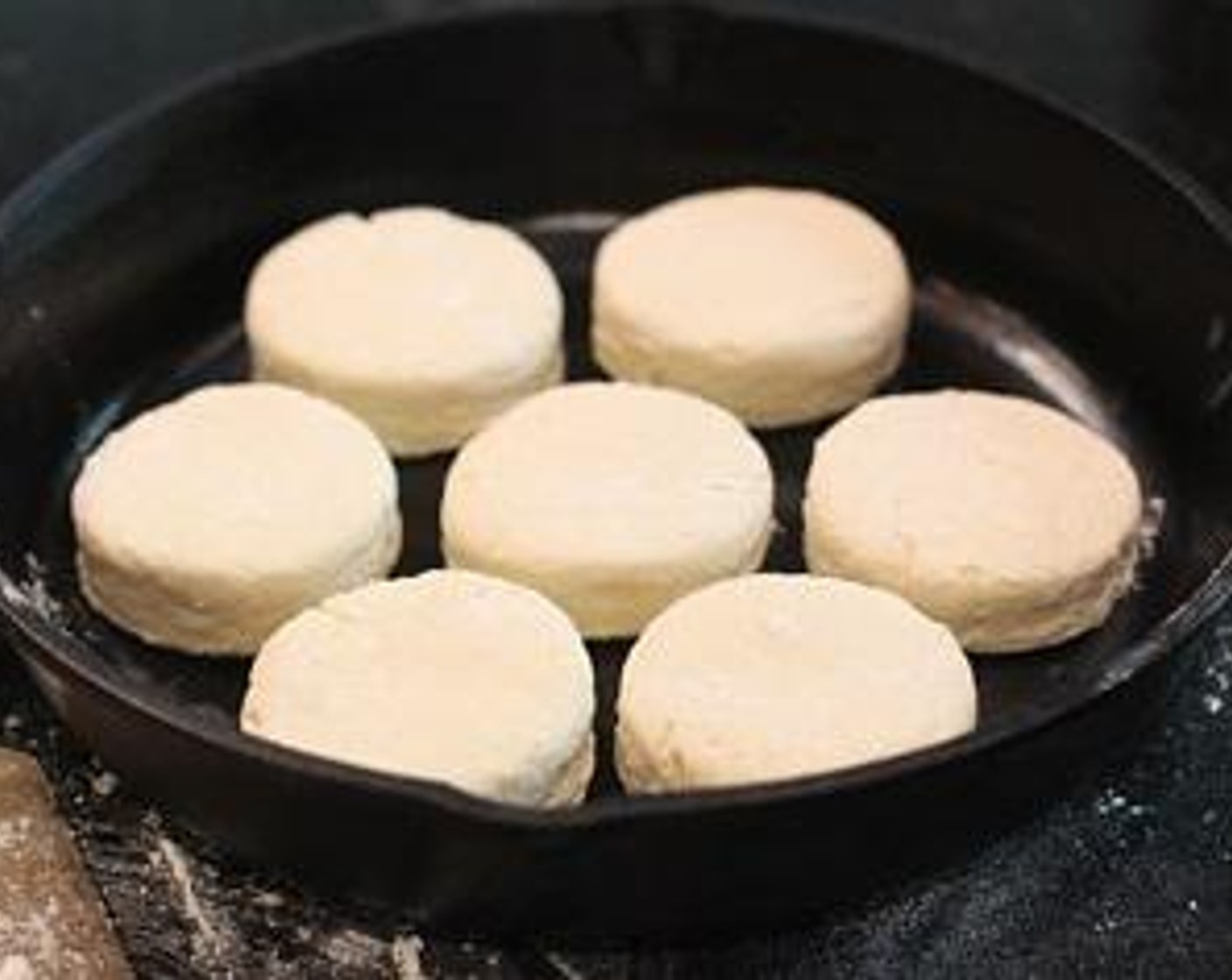 step 5 Transfer to a buttered cast iron skillet spacing about 1/2 inch apart. Gather scraps, reshape, and cut out.