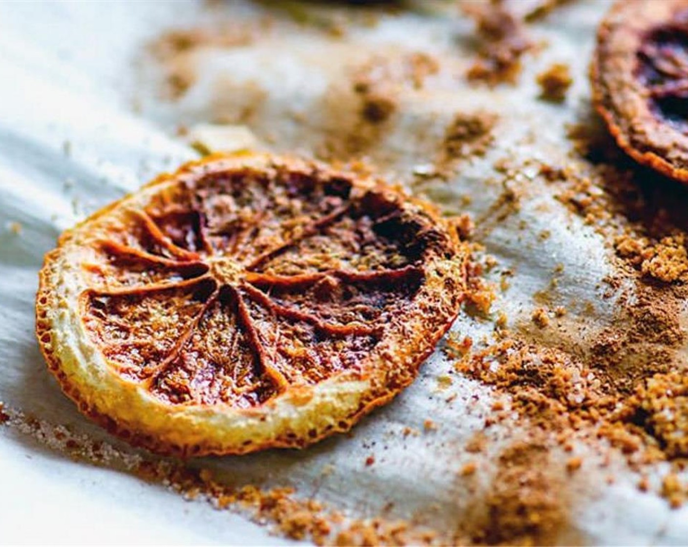 step 2 In a small bowl, mix the Coconut Sugar (1/4 cup), Ground Ginger (1 dash), Sea Salt (1 dash), and Ground Cinnamon (1/2 tsp). Sprinkle the mixture evenly over the oranges.