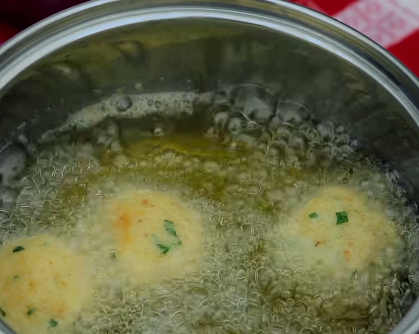 step 9 Next, place a few balls into the pan and cook them cheese balls for approximately 2 minutes.