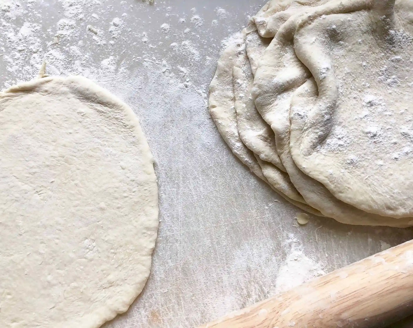 step 7 On a lightly floured surface, roll each one into a large oval about 8-inches in length and 1/4-inches thick. As you form the ovals and stack them in a pile, be sure to sprinkle them with flour to prevent sticking.