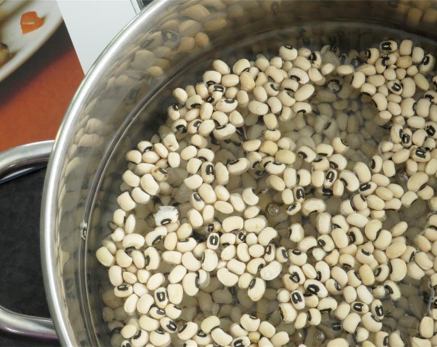 step 2 Place Dry Black Eyed Peas (4 3/4 cups) in a large pot. Sort through the beans and remove any foreign material (i.e. pebbles, poor quality beans, etc.). Add enough water to cover beans by about 3 inches. Soak overnight at room temperature.