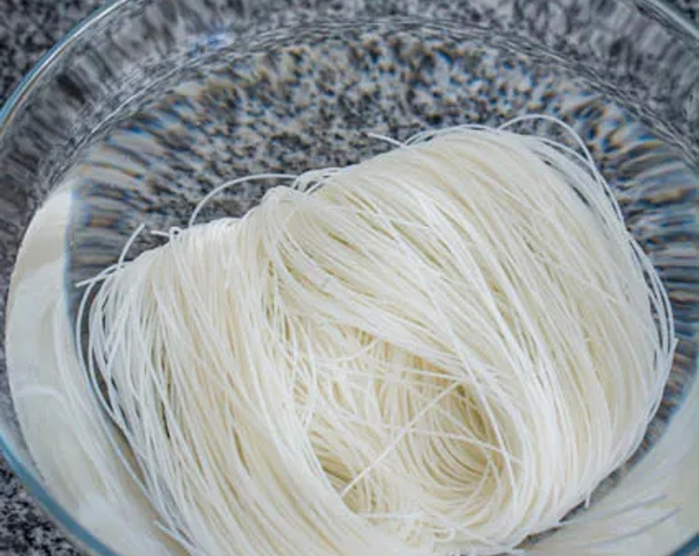 step 1 Soak uncooked Vermicelli Noodles (3.5 oz) in room-temperature water for 30 minutes.