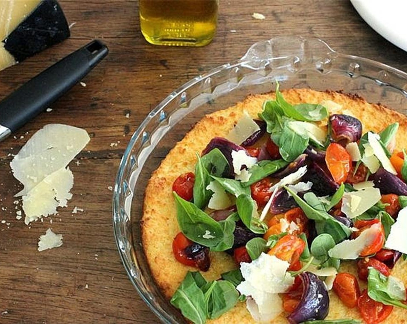 step 8 Mound tomatoes and onions on top of the ricotta, then scatter Arugula (1 cup) and Shaved Parmesan Cheese (to taste).