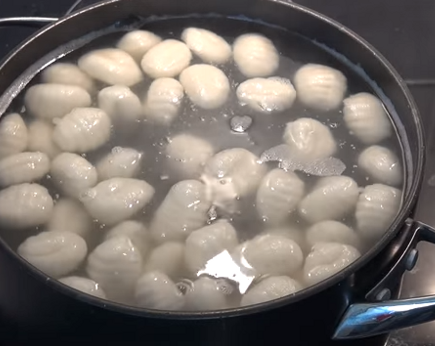 step 1 Boil a pot of water. When bubbling, carefully add Gnocchi (1.1 lb). When the gnocchi bob to the surface, they're done and you can scoop them out with a slotted spoon. Drain on a paper towel.
