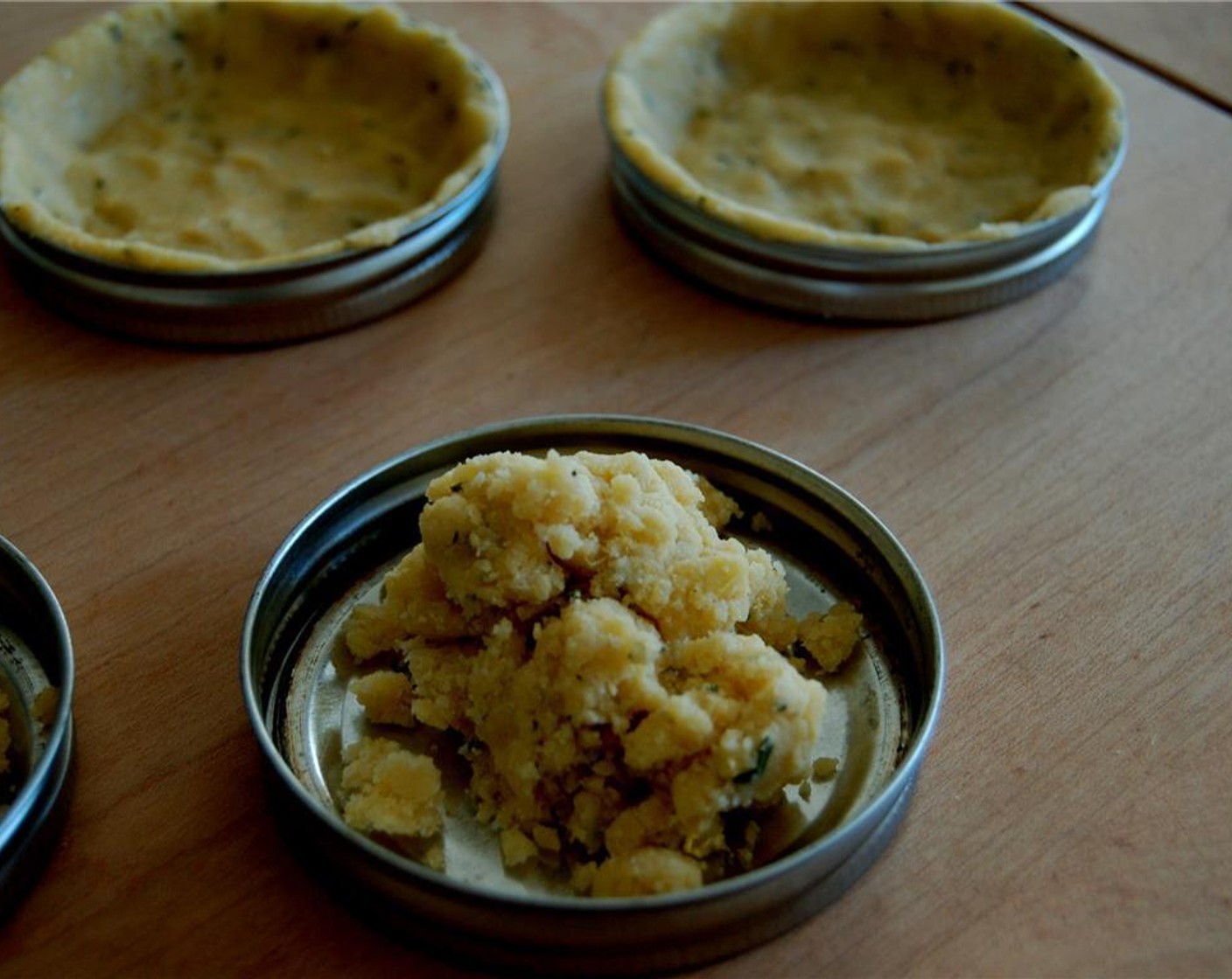 step 6 Divide the dough into 8 wide mouth mason jar lids or make it into one 10-inch tart pan with a removable bottom. Place the filled “tart pans” into the freezer for about 20 minutes.