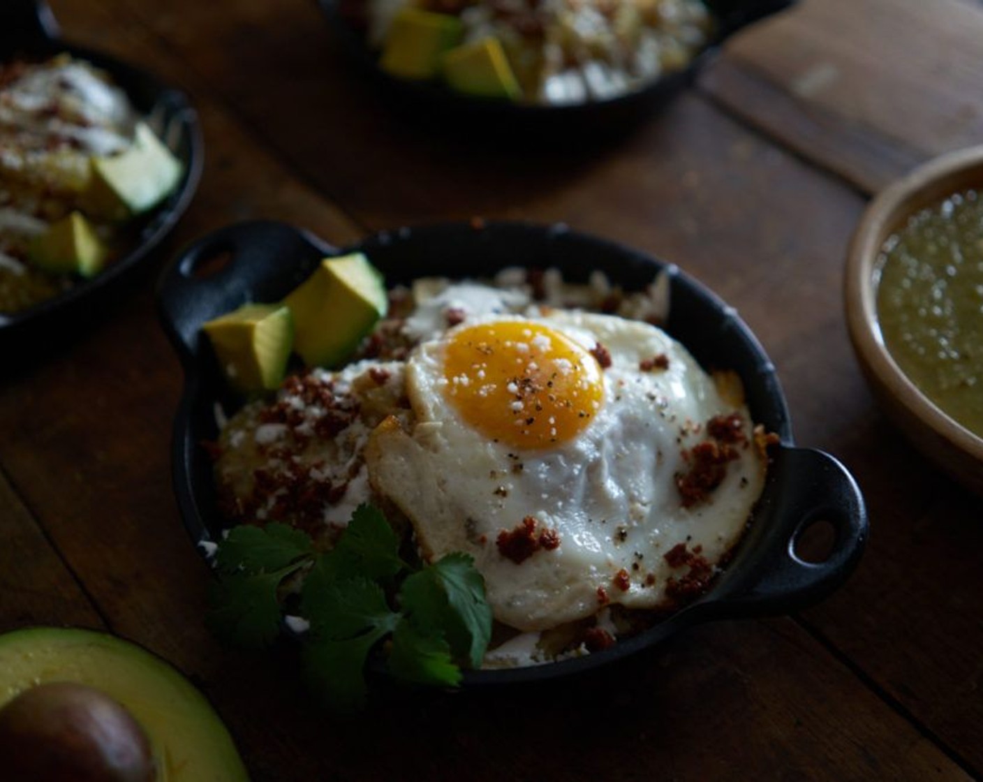 step 12 Top chips with chorizo, fried eggs, and Cotija Cheese (to taste) if desired. Garnish with Avocado (1) and Fresh Cilantro (to taste).