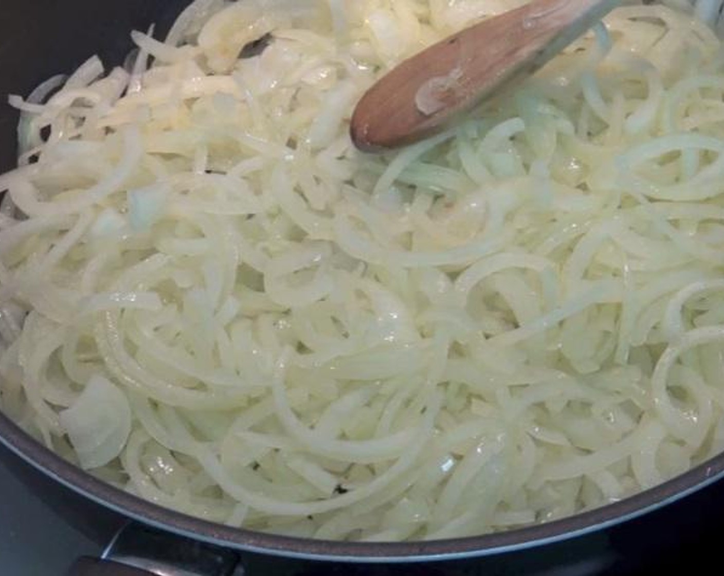 step 1 In a large frying pan over medium heat, add the Olive Oil (1/4 cup). once the oil is heated up add your Yellow Onions (6 1/4 cups), and cook for about 3 minutes. Turn the temperature down to low and cook for 15 more minutes.