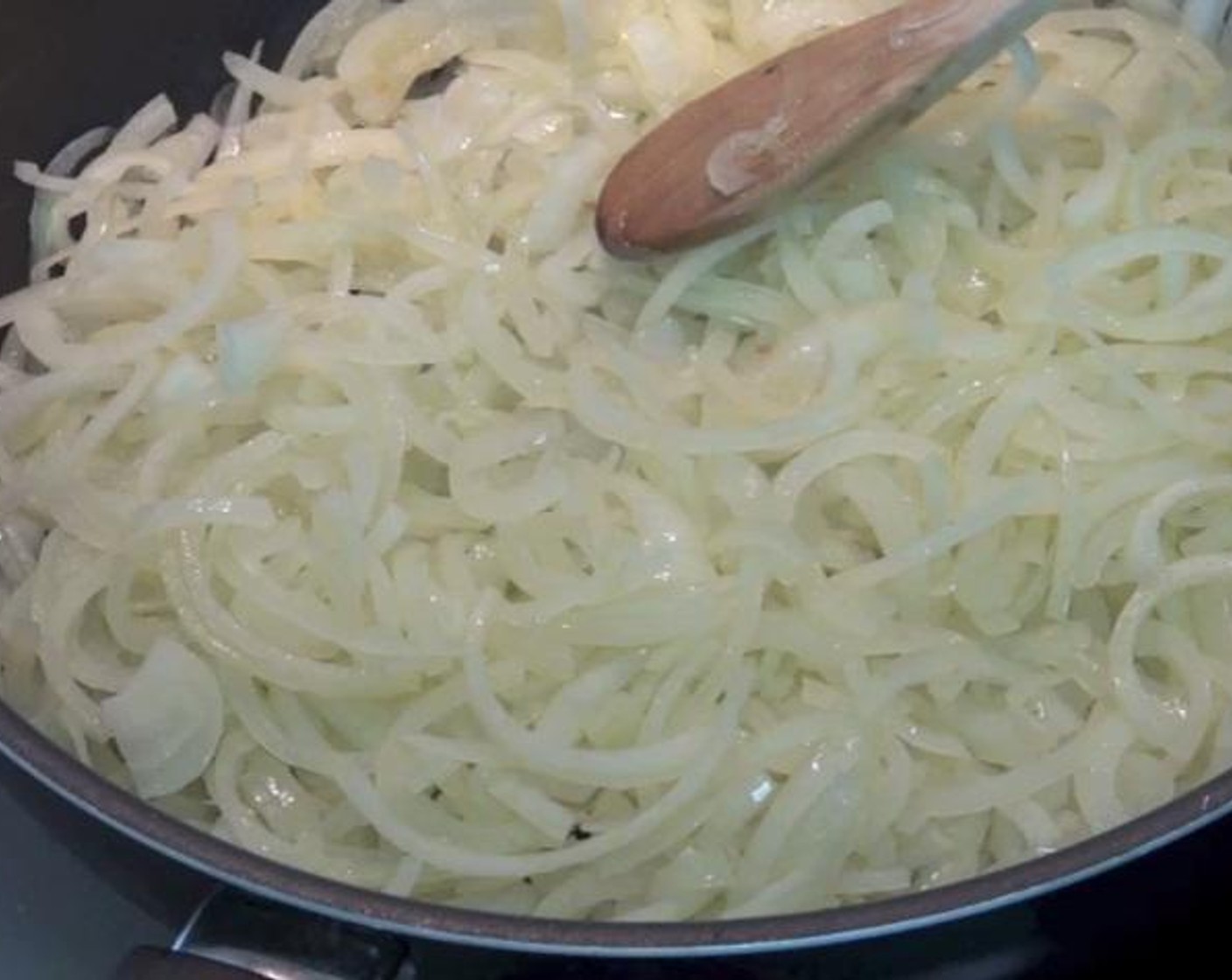 step 1 In a large frying pan over medium heat, add the Olive Oil (4 Tbsp). once the oil is heated up add your Yellow Onions (6 1/4 cups), and cook for about 3 minutes. Turn the temperature down to low and cook for 15 more minutes.