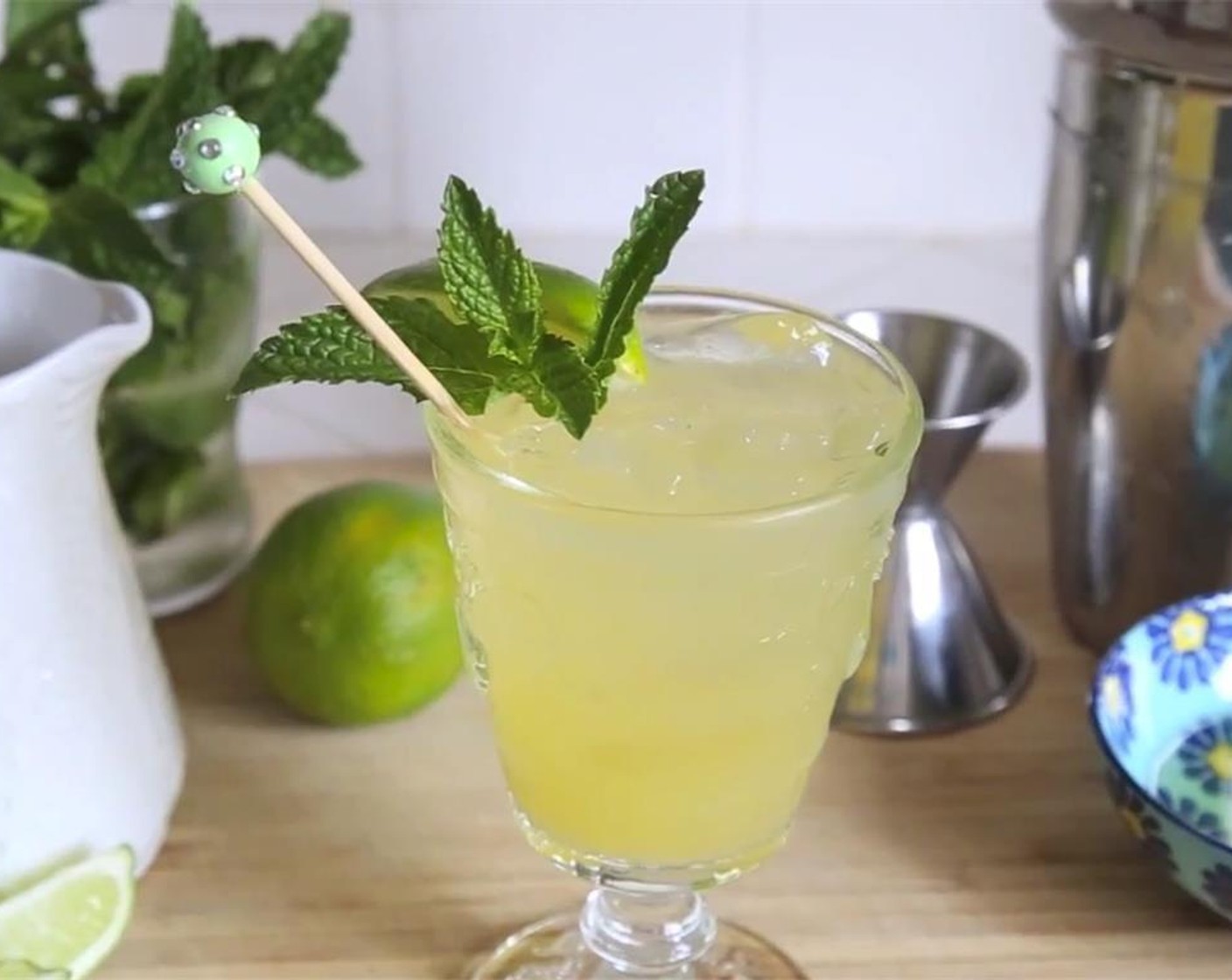 step 9 Stir mojito with cocktail stirrer, garnish with lime wedge and mint sprig. Serve and enjoy!