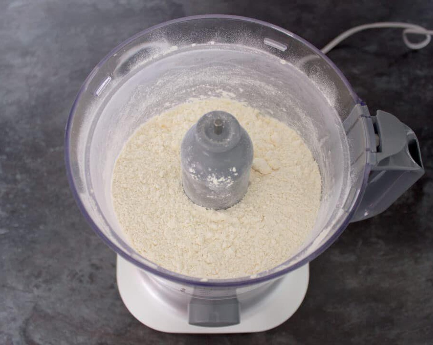 step 1 To make the pastry, dump All-Purpose Flour (2 cups), Unsalted Butter (1/2 cup), and Salt (1 pinch) into a food processor & blitz until it becomes fine breadcrumbs.