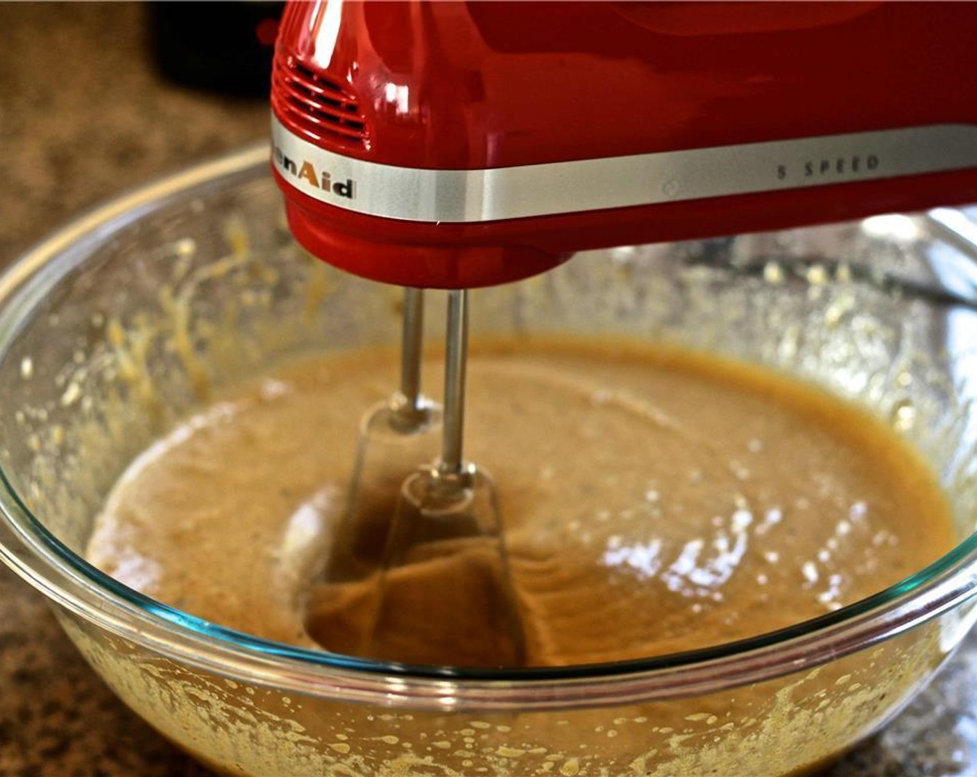 step 4 In a separate bowl, use a hand mixer or a stand mixer to combine the Dark Brown Demerara Sugar (1/2 cup), Granulated Sugar (1 1/2 cups), Meyer Lemon Olive Oil (1 cup), Salt (1/4 tsp) and Vanilla Extract (1 tsp). Beat in the Farmhouse Eggs® Large Brown Eggs (5) one at a time.