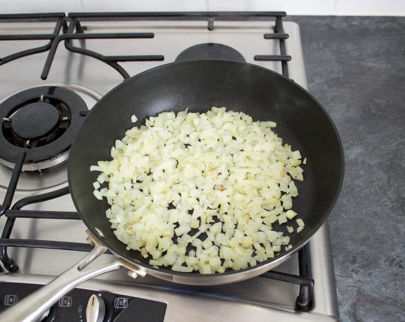 step 2 Heat a large non-stick saucepan over a medium heat. When the pan is hot, add the Rice Bran Oil (2 Tbsp) followed by the diced onion. Fry, stirring often, for about 5 minutes until onion just starts to turn golden.