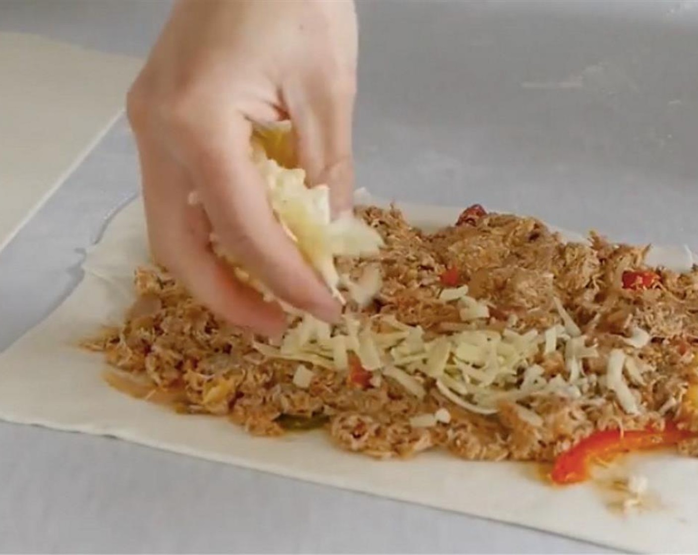 step 9 Add the Cheddar Cheese (2 cups), spreading it evenly over the chicken.