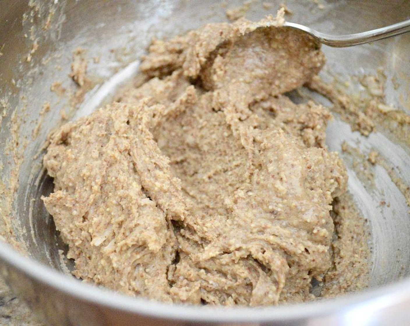 step 3 While the mixture melts, quickly stir the Almond Butter (3/4 cup), Unsweetened Shredded Coconut (4 Tbsp) and Honey (1 Tbsp) together thoroughly to make the filling.