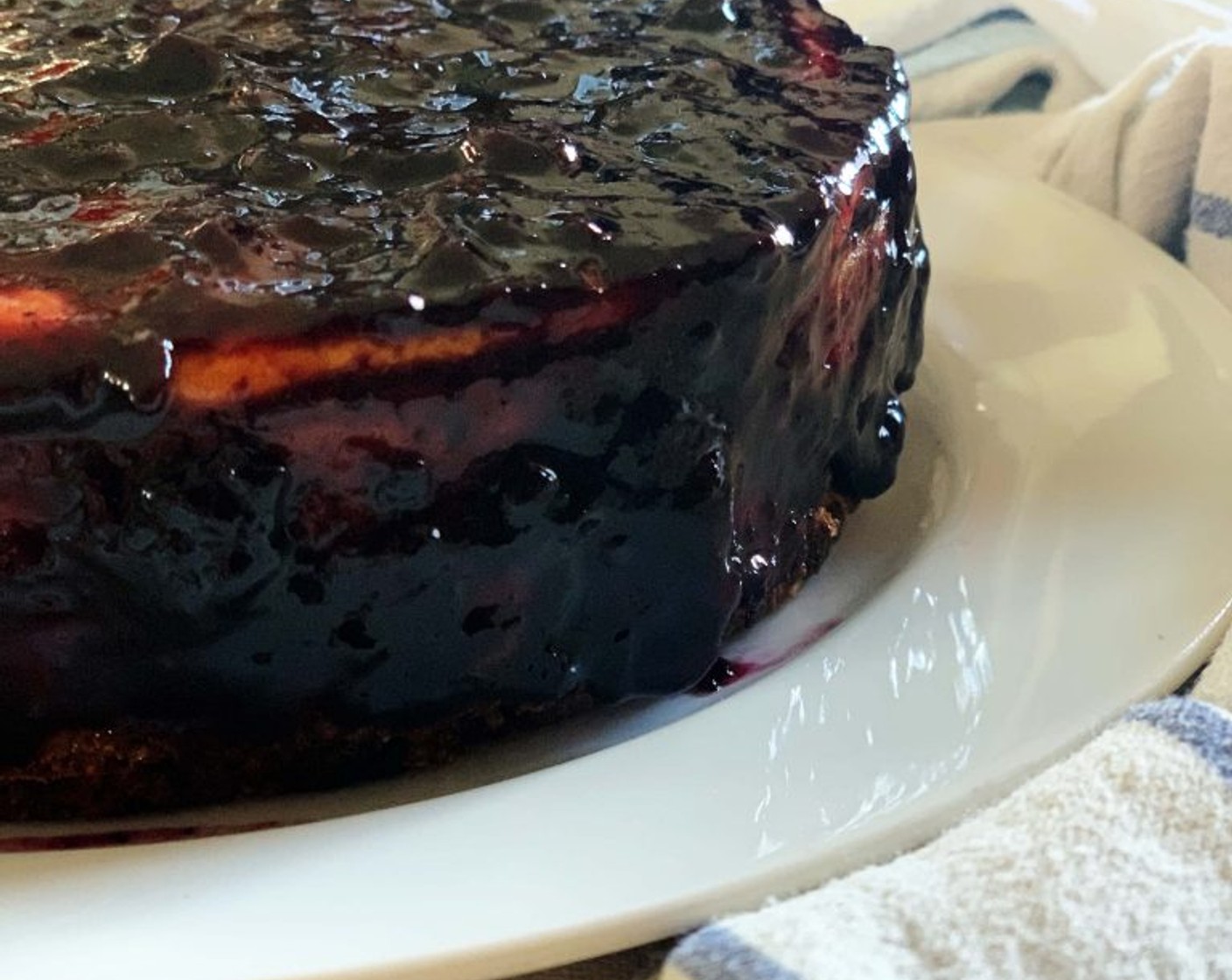 step 8 After the cake completely cooled, with a spatula spread the Blueberry Jam (1 jar) evenly on top and along the sides. Refrigerate for a few hours before serving.