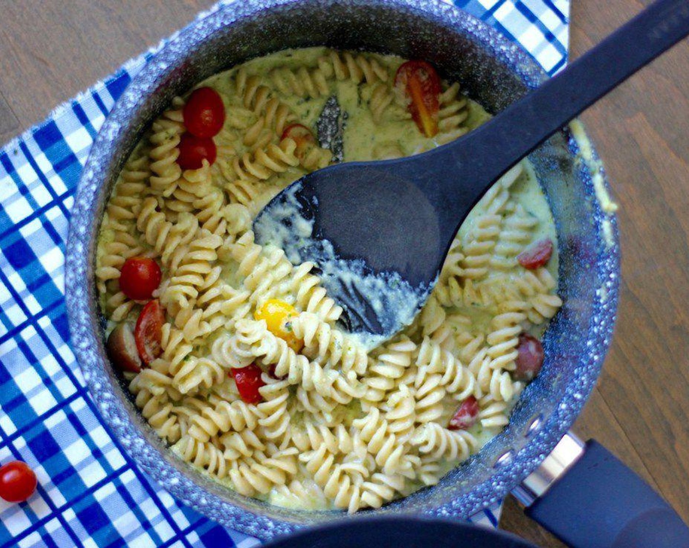 step 4 Add in the pasta and stir until it is well coated. Mix in Heirloom Cherry Tomato (1 cup), Salt (to taste), and Ground Black Pepper (to taste). Serve while hot!