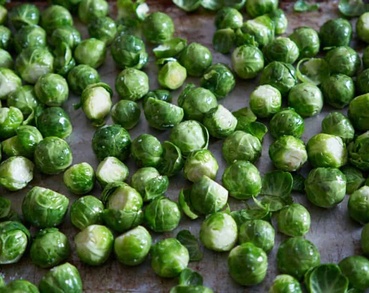 step 3 Place sprouts on a baking sheet and drizzle with the Olive Oil (2 Tbsp) and a pinch or two of Kosher Salt (to taste). Mix them all together so they are evenly coated and bake for 15 minutes.