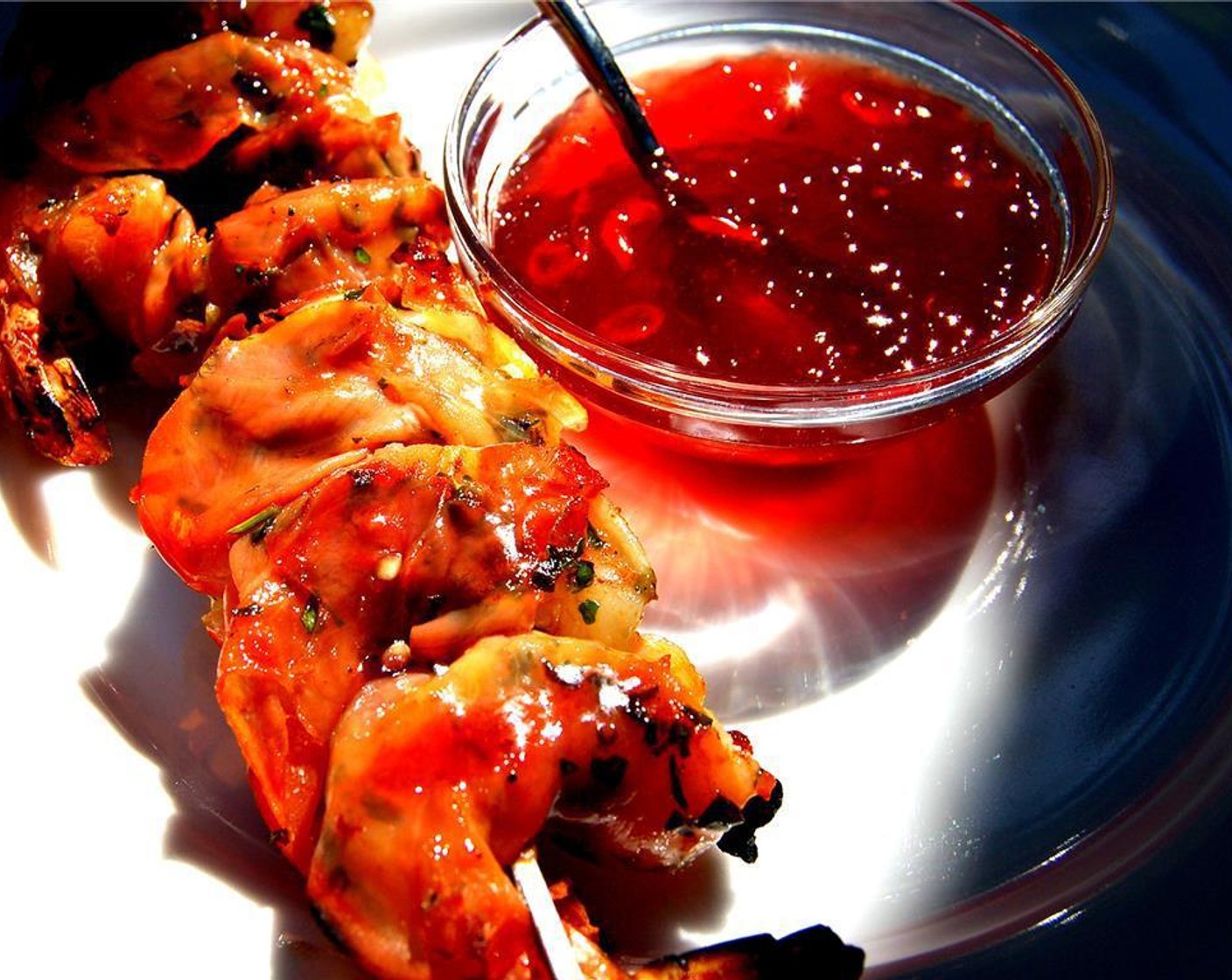 step 7 Discard any basting spread. Drizzle the shrimp with the reserved grape spread and save the rest for dipping.