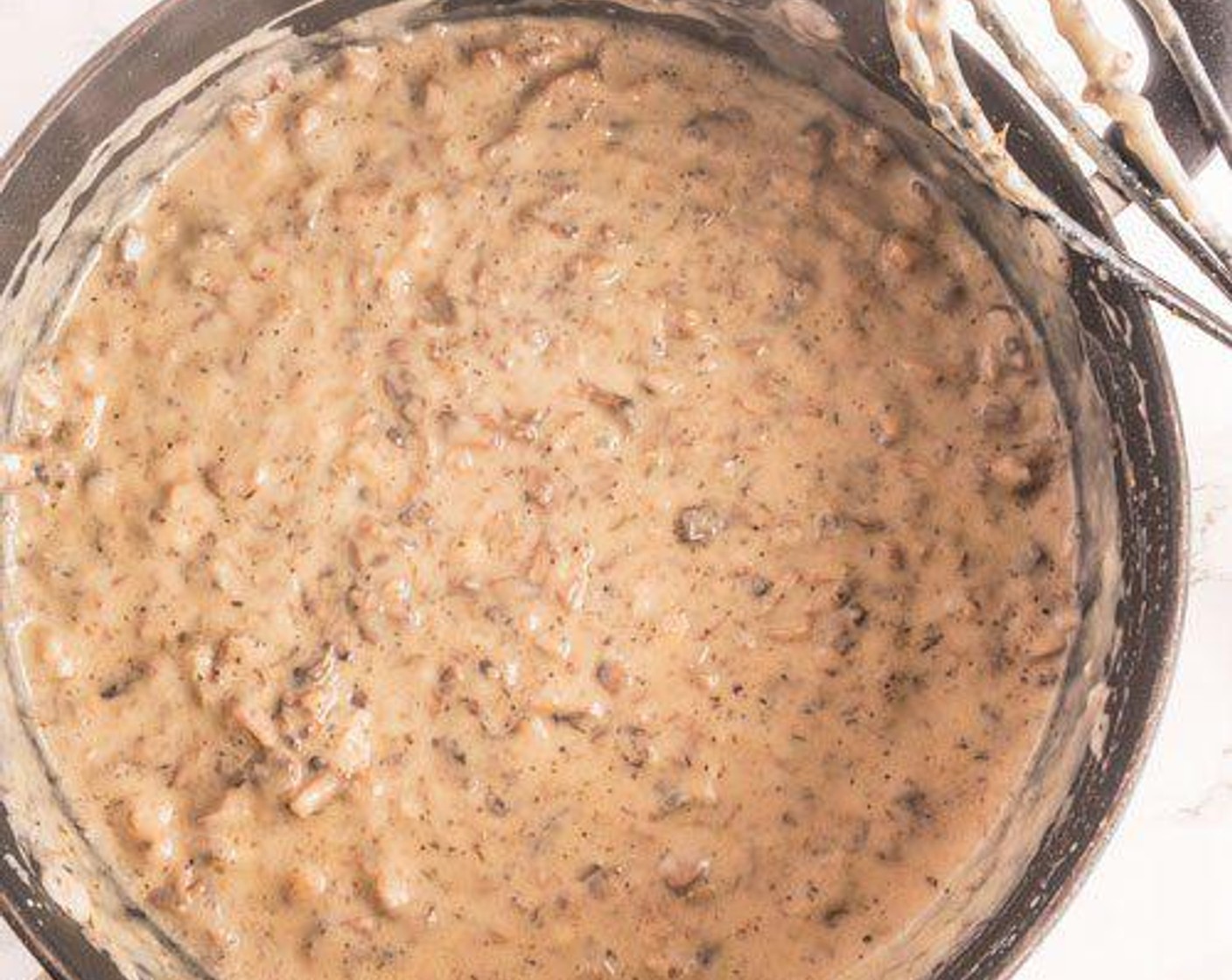step 3 In separate pan, whisk Almond Milk (2 cups), All-Purpose Flour (3 Tbsp), Buttery Spread (2 Tbsp), and Soy Sauce (2 Tbsp). Add Brown Mushrooms (2 cups) and Greek Seasoning (1 tsp) and continue to whisk while bubbling until thick.