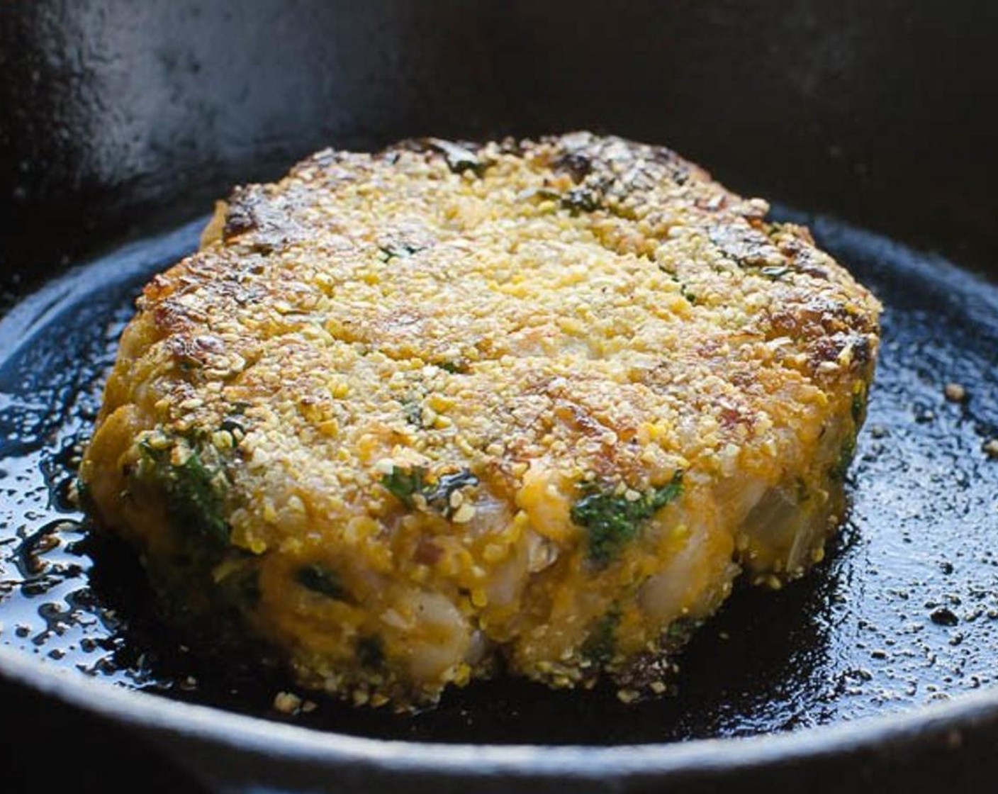 step 7 Meanwhile, add the Cornmeal (1/2 cup) to a shallow dish. Add Olive Oil (2 Tbsp) to the skillet and heat over medium-high heat. Coat the patties in the cornmeal and add to the hot pan. Cook patties for four to five minutes per side until they are crispy and browned