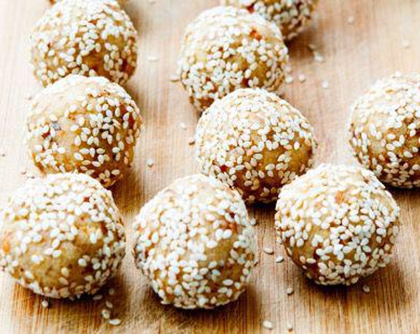 step 3 Using your hands, roll the mixture into 30-gram balls and coat them in White Sesame Seeds (to taste).