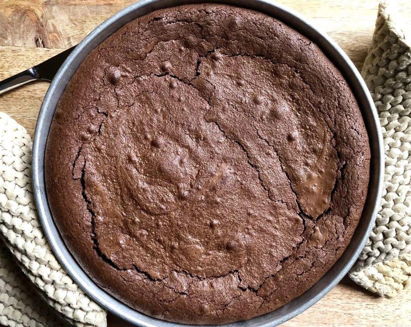 step 6 Let the cake cool in the pan for 5 minutes. Run a knife around the edges to loosen, and flip the cake onto a serving platter or cake stand. Let cool completely.