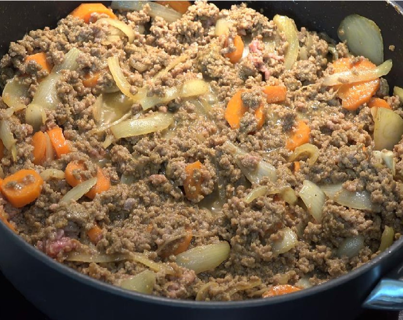 step 3 Add Ground Beef (2.2 lb). Break it up with a wooden spoon and raise the heat up to medium-high. Cook until the for about ten minutes, until the meat is browned.