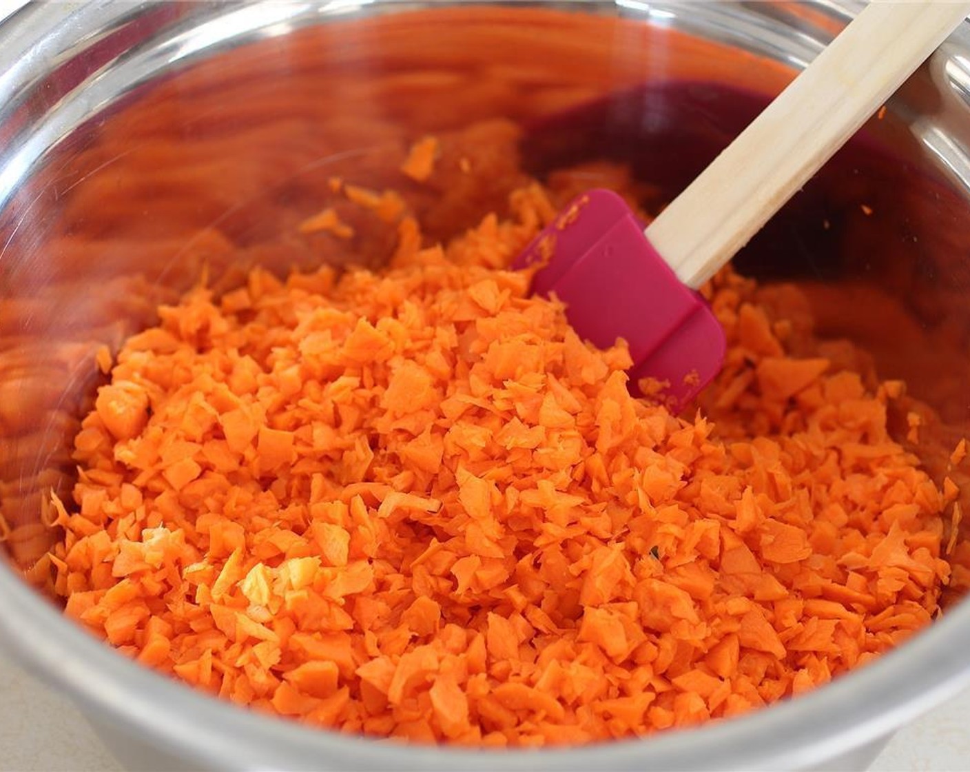 step 3 In the meantime, run the Carrots (4), Red Onion (1), Fresh Cilantro (1 cup), and Garlic (4 cloves) through the food processor as well and then place into a big mixing bowl.